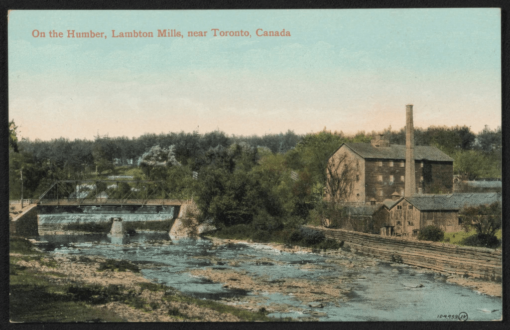 The Humber River in the foreground with the three storey Lampton Mills, built in 1845 along the banks. Dundas Street cross the river north of the mill along a rudimentary looking bridge.